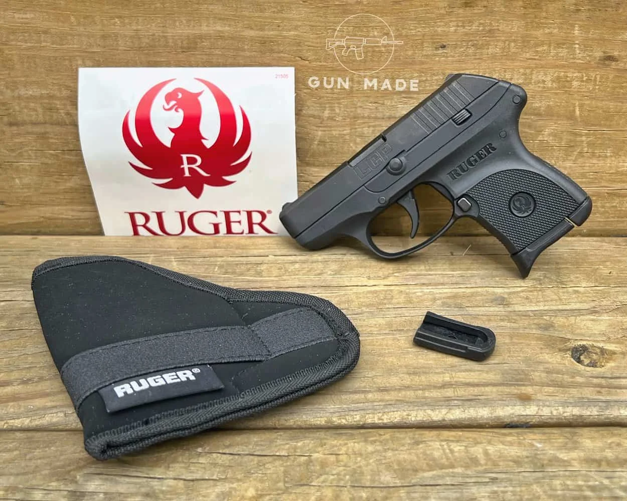 Ruger LCP 380 with Ruger sticker and holster on bench