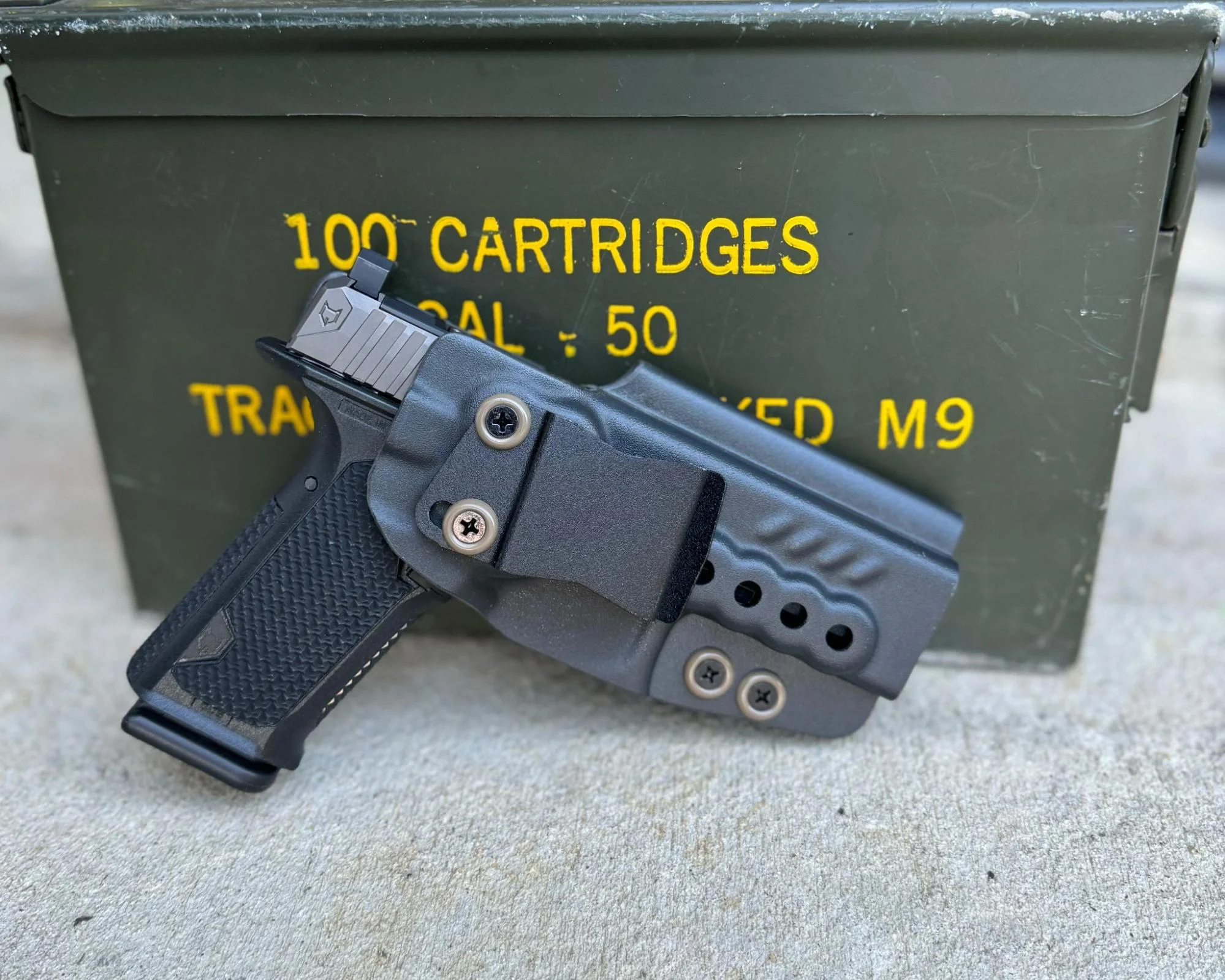 lone wolf dusk 19 leaned against ammo can and holstered