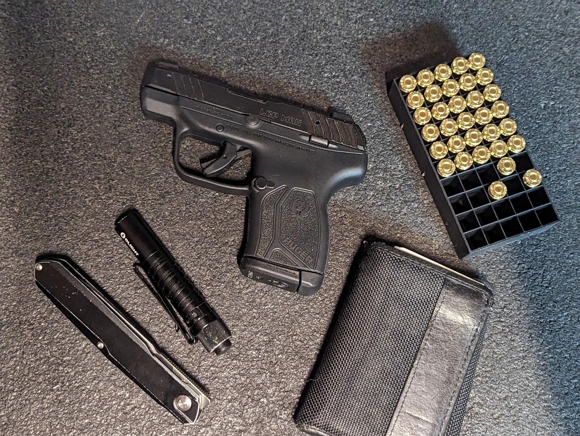 ruger lcp max review with 380 auto ammo and magazine flashlight