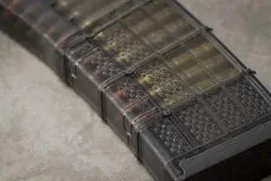 Lancer L5AWM 30 magazine, focusing on its translucent body that offers a view of the rounds inside