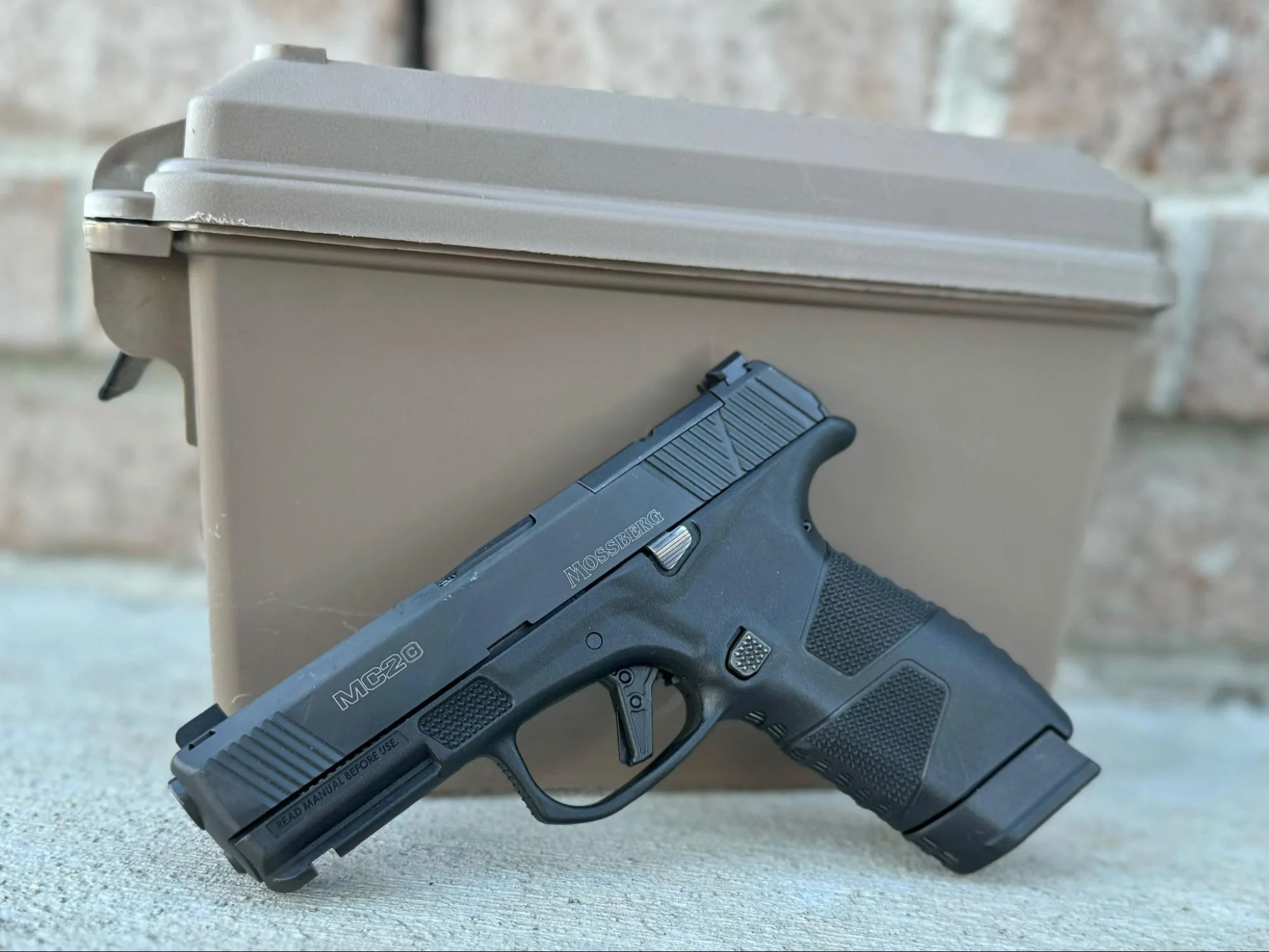 mossberg mc2c leaning against ammo can