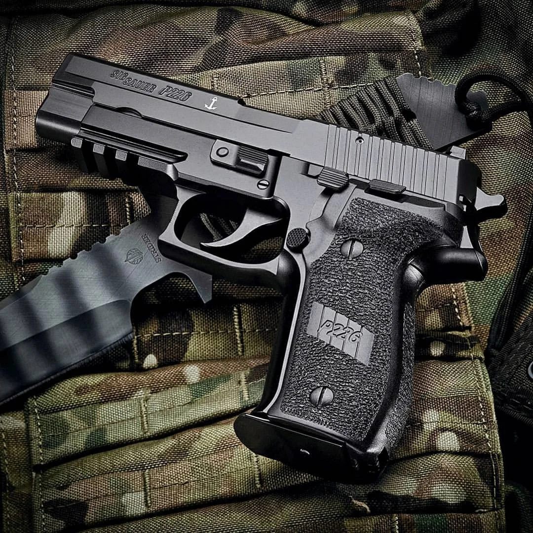 sig sauer p226 close up camo background