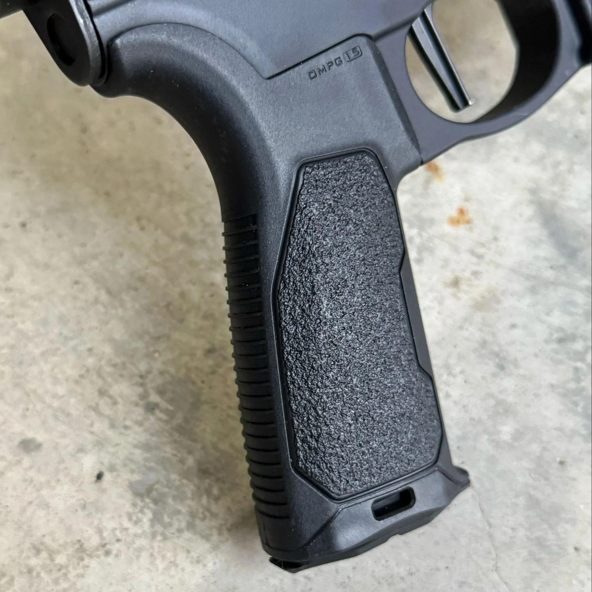 A close-up view of the rubber overmold on a Strike Industries AR grip, focusing on its balanced texture