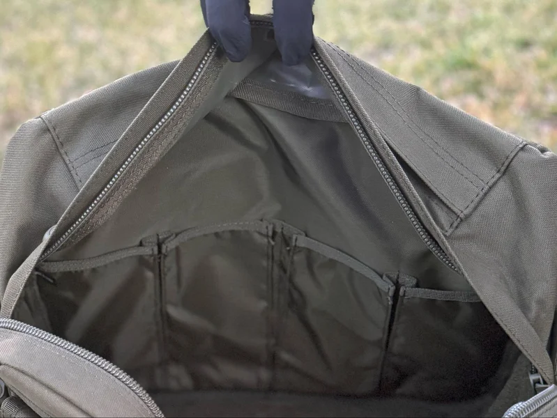 A hand holding a Bail Out Bag