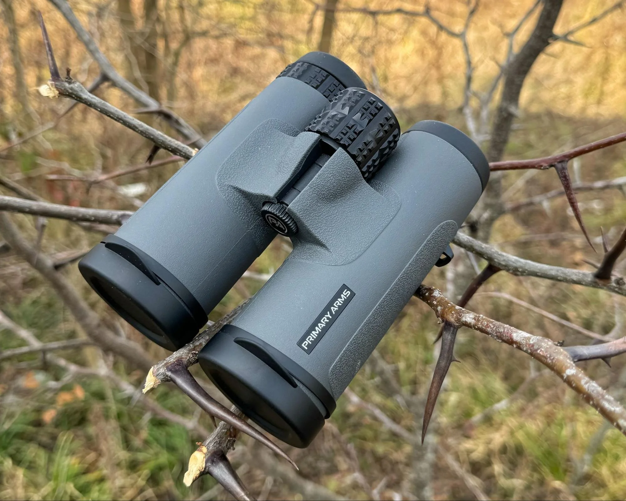 A pair of GLx binoculars with a distinctive grey finish, making them easy to locate