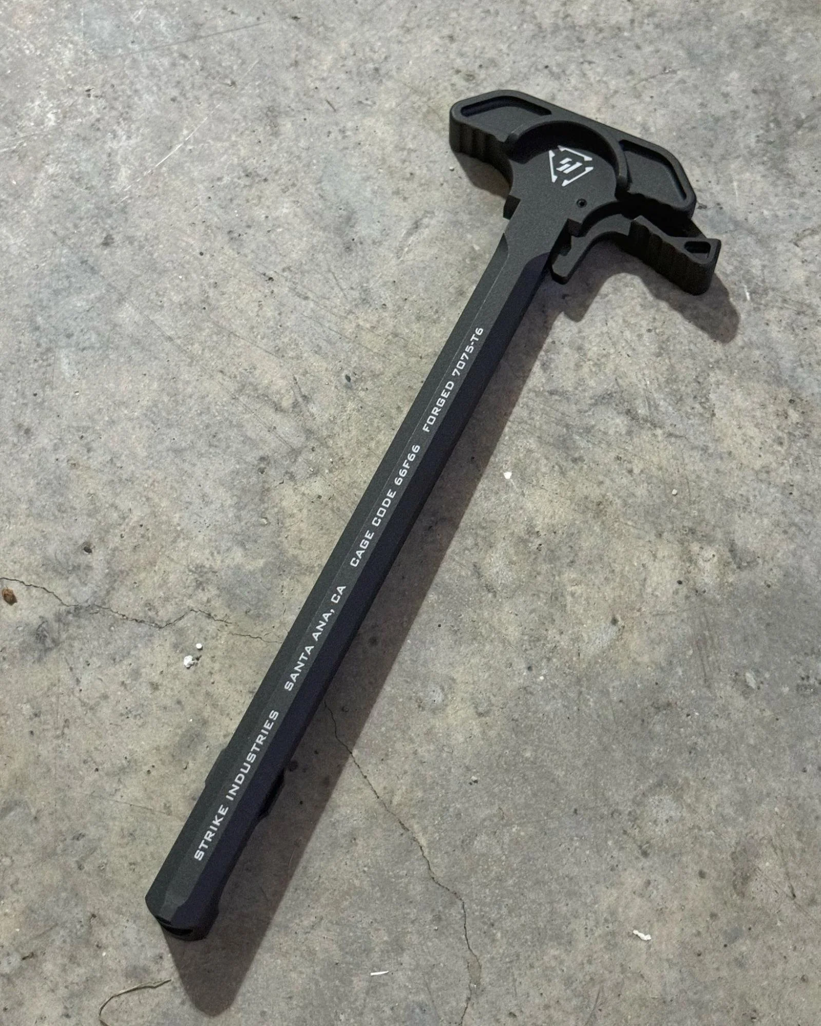 Strike Industries ARCH-EL Charging Handle on ground