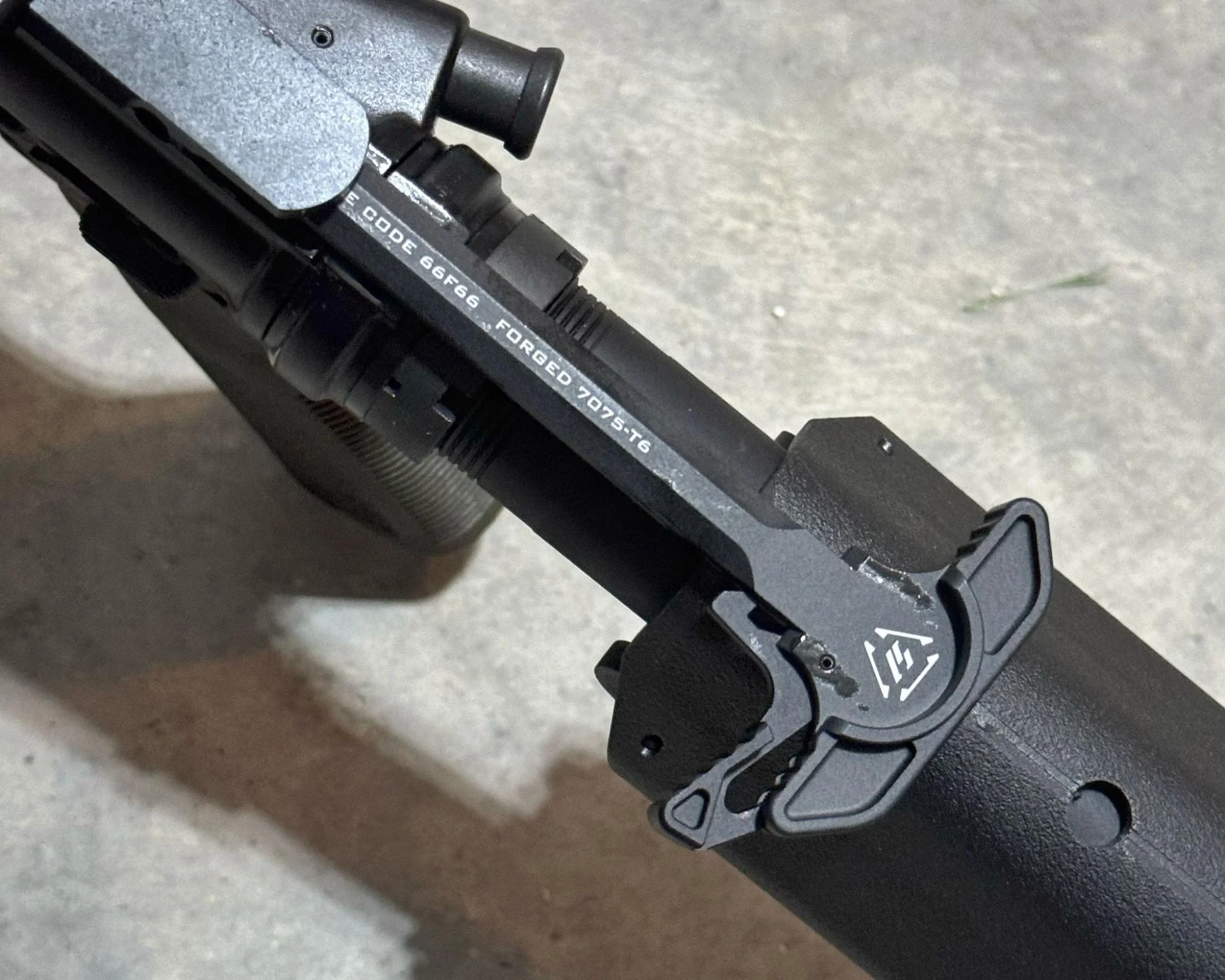 Strike Industries ARCH-EL Charging Handle with Extended Latch hands on close up