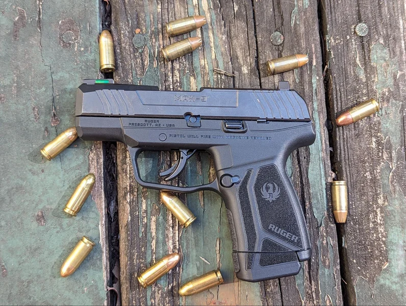 ruger max9 on table with 9mm ammo