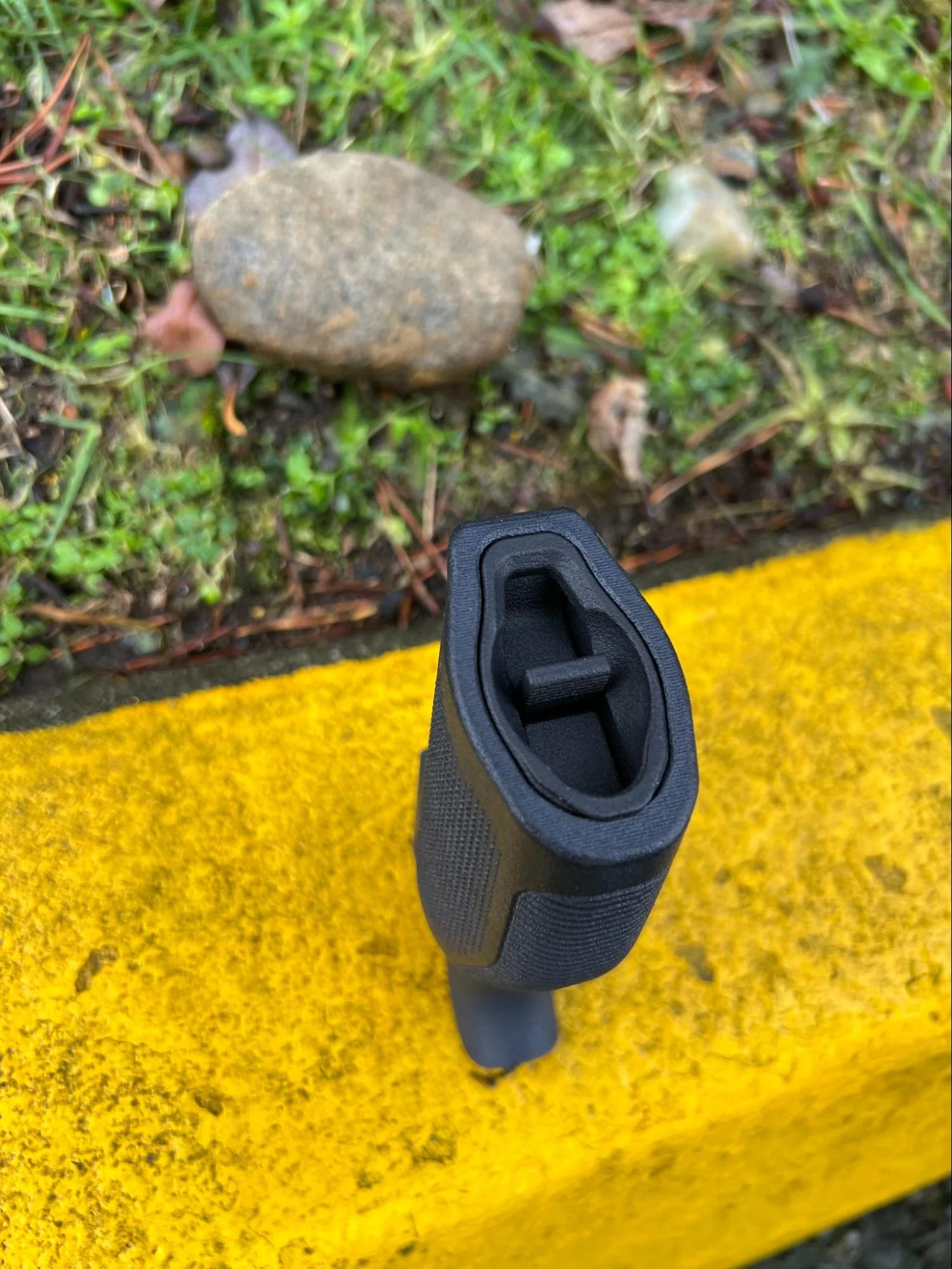 Simply pull the tab back and down to open