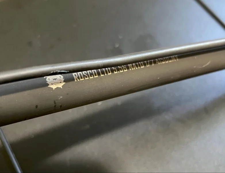 Detailed view of Rosco HBAR barrel featuring prominent stamps and markings unique to Rosco Manufacturing.