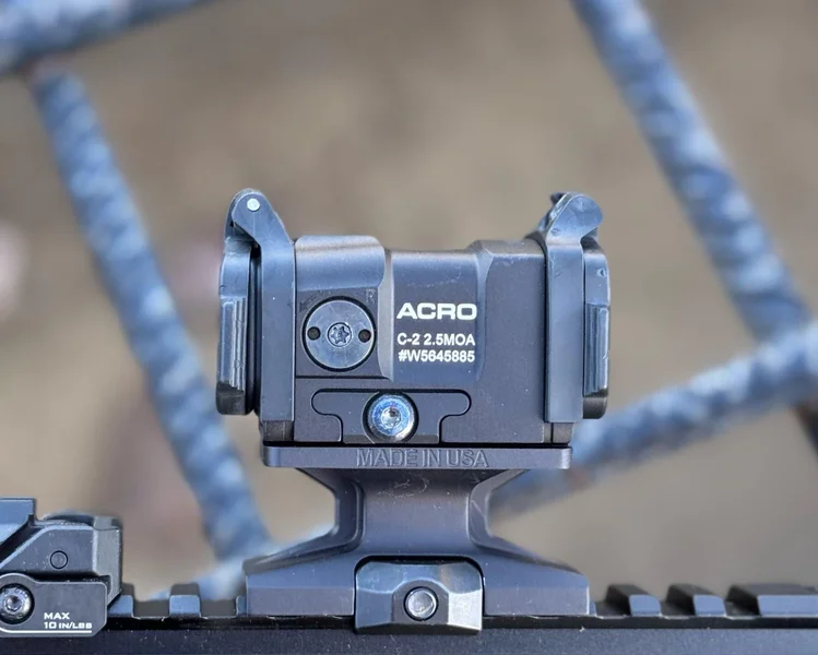 Aimpoint Acro C-2 optic mounted on a carbine, demonstrating its small yet powerful design.