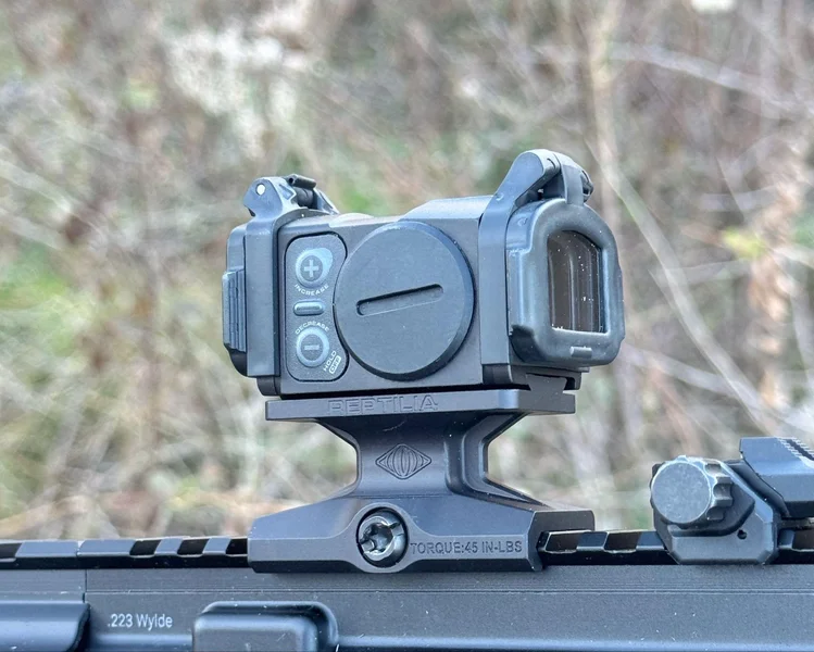 Aimpoint Acro C-2 with flip-up lens caps in place, providing additional lens protection