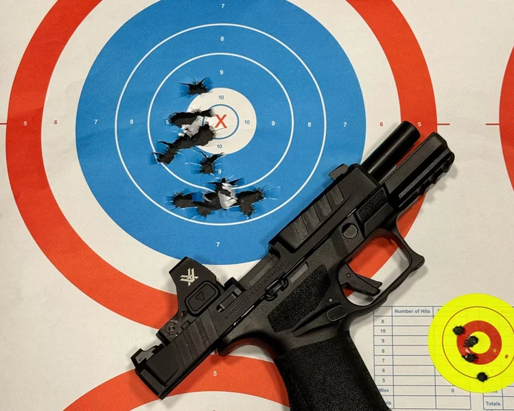 Target sheet showing low initial shots from the Springfield Armory Echelon 4.0C, later adjusted for accuracy