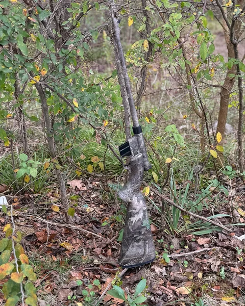 Henry Survival Rifle in True Timber Kanati Camo Pattern, blending with Tennessee foliage