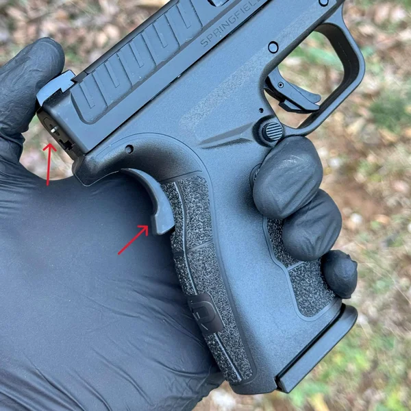 Close-up of the XD Mod.3 frame, highlighting the mag release button