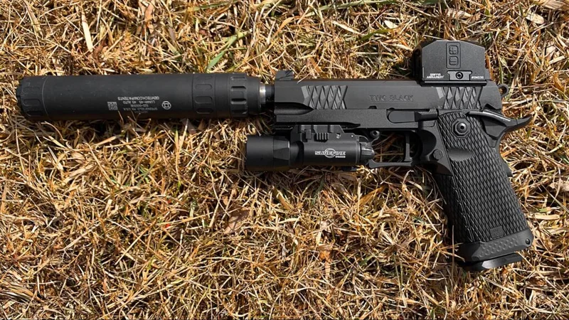 Close-up of the Jacob Grey TWC Black grip module, showcasing diamond pattern texture and aluminum frame gemtech 45 suppressor