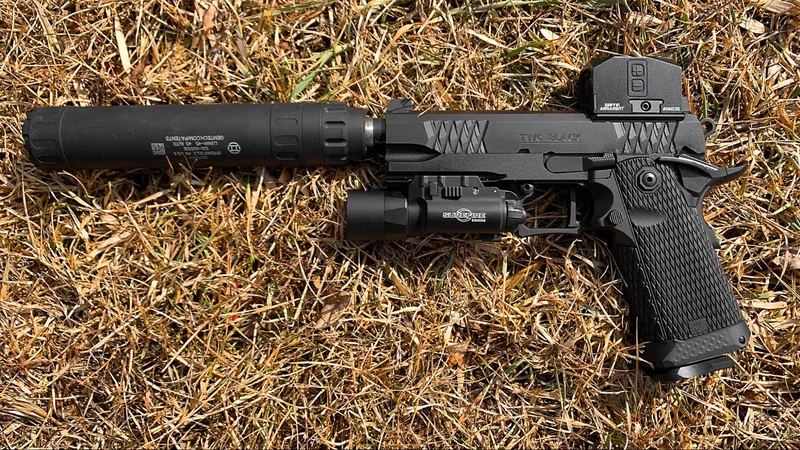 Close-up of the Jacob Grey TWC Black grip module, showcasing diamond pattern texture and aluminum frame gemtech 45 suppressor