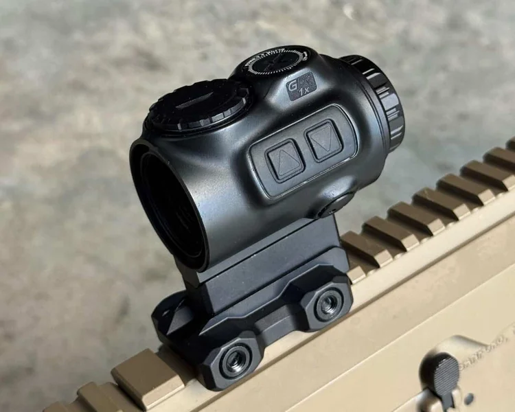 Side view of GLx 1x optic on rifle rail, showing separated adjustment buttons and mount.