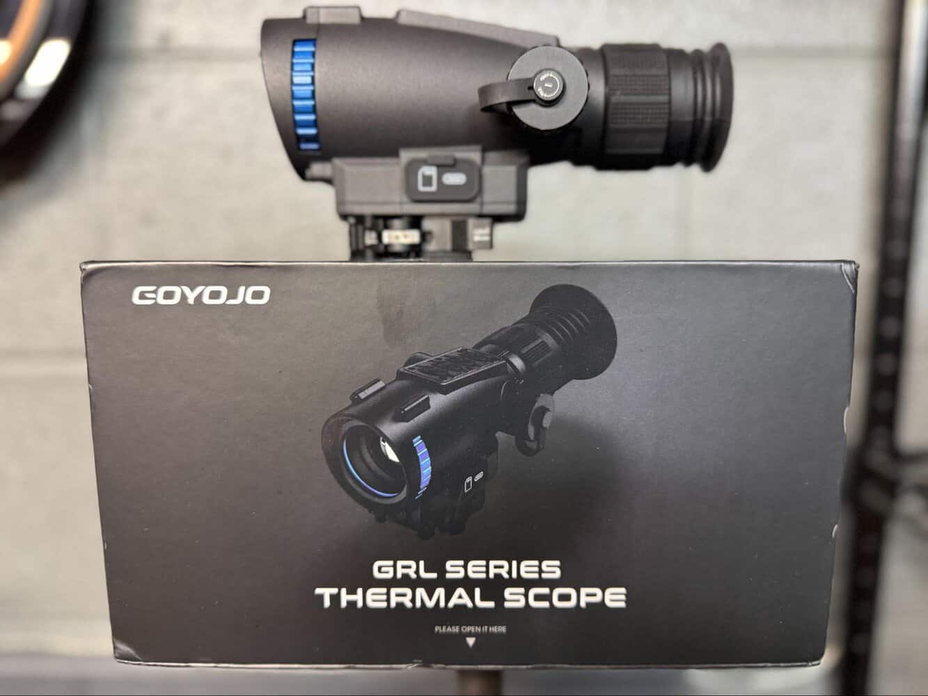 Goyojo GRL335 thermal scope displayed on rifle above GRL Series Thermal Scope packaging box