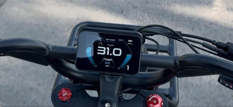 Handlebar view of Birch Grolar AWD hunting bike showing LED display at 31.0 mph, highlighting top speed capability.