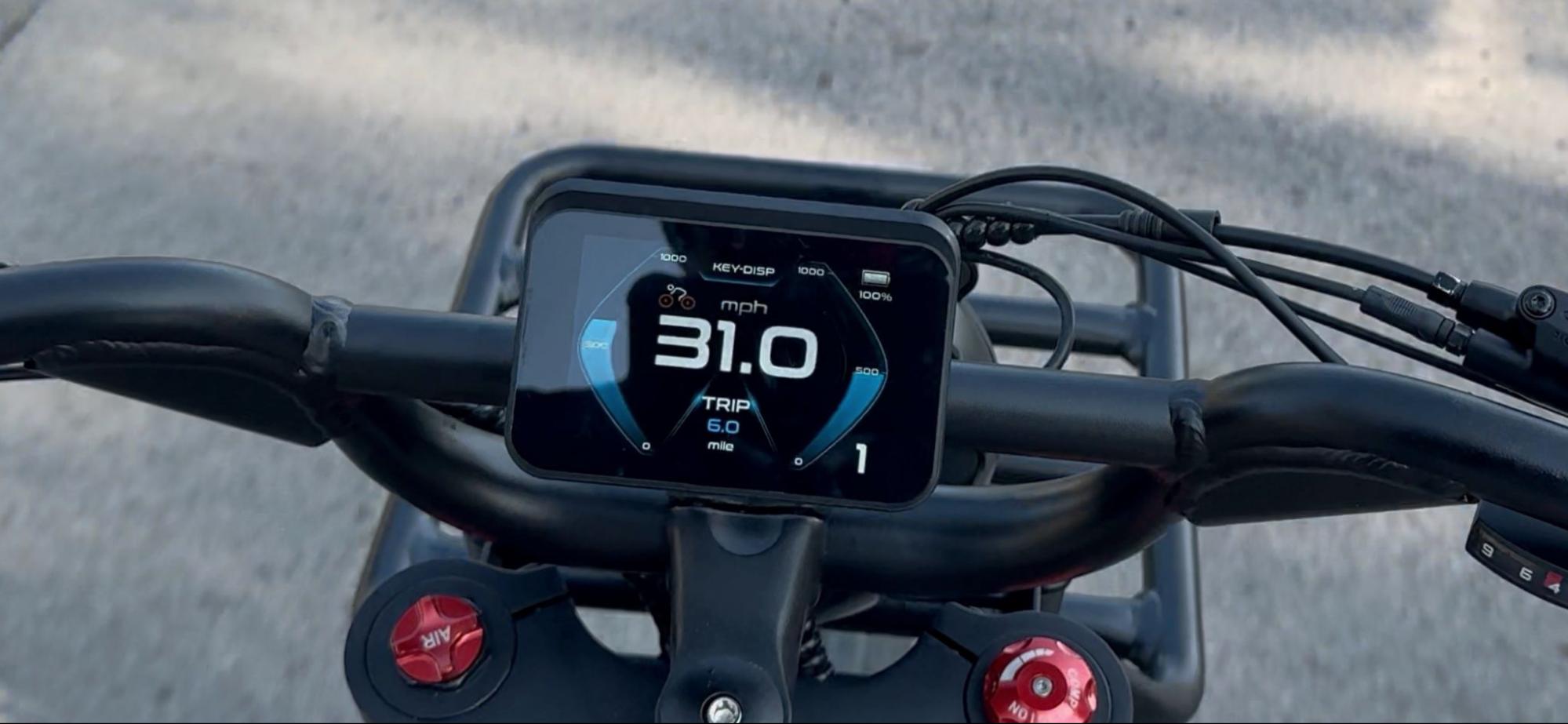 Handlebar view of Birch Grolar AWD hunting bike showing LED display at 31.0 mph, highlighting top speed capability.