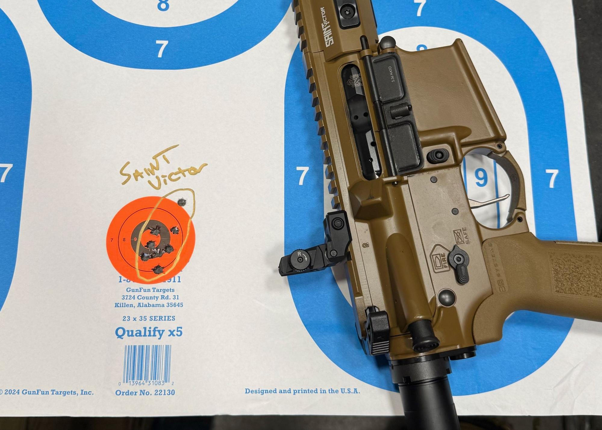 Springfield Armory Saint Victor V2 rifle resting on target with close-range grouping results