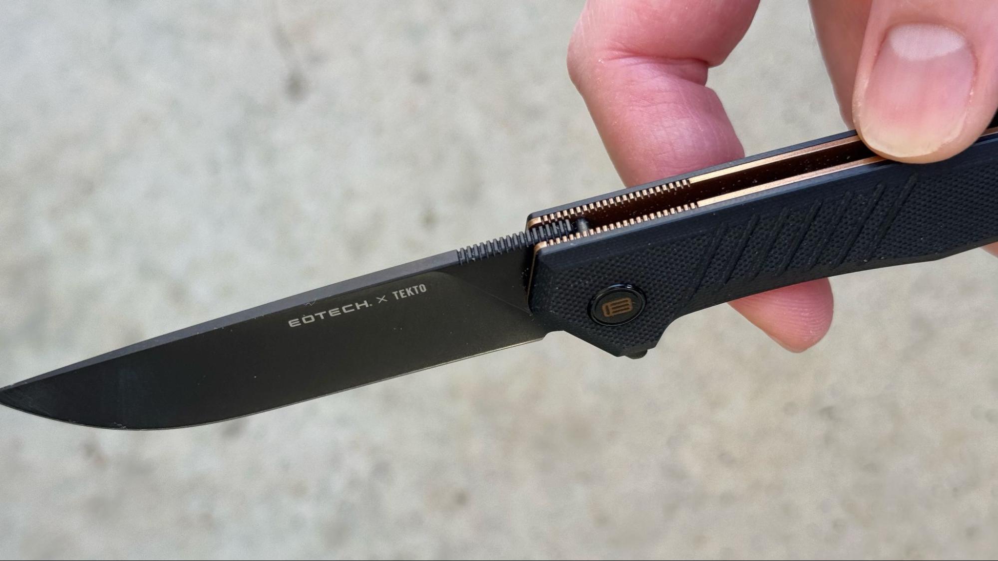 Close-up of the Tekto F1 Alpha EOTECH knife blade and jimping details
