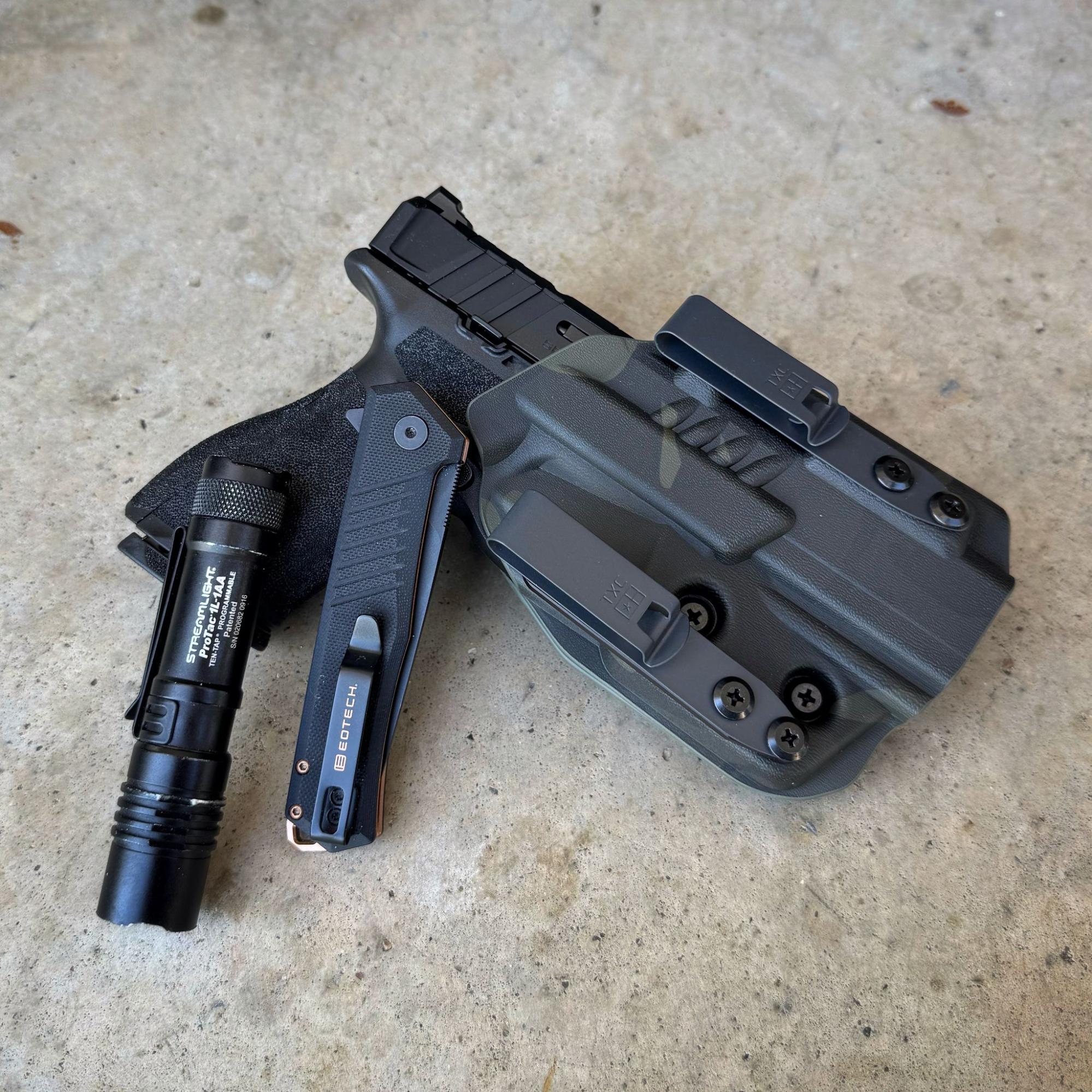Everyday carry loadout with Tekto F1 Alpha EOTECH knife, tactical flashlight, and holstered pistol