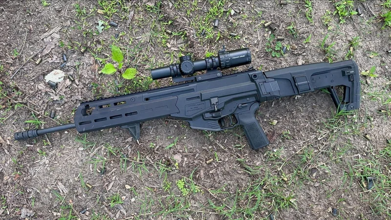 IWI Carmel rifle with mounted optic lying on the ground after range session, surrounded by spent casings