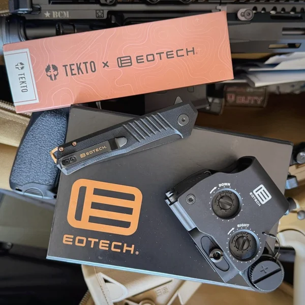 Tekto F1 Alpha EOTECH Edition knife next to EOTECH optic and branded packaging