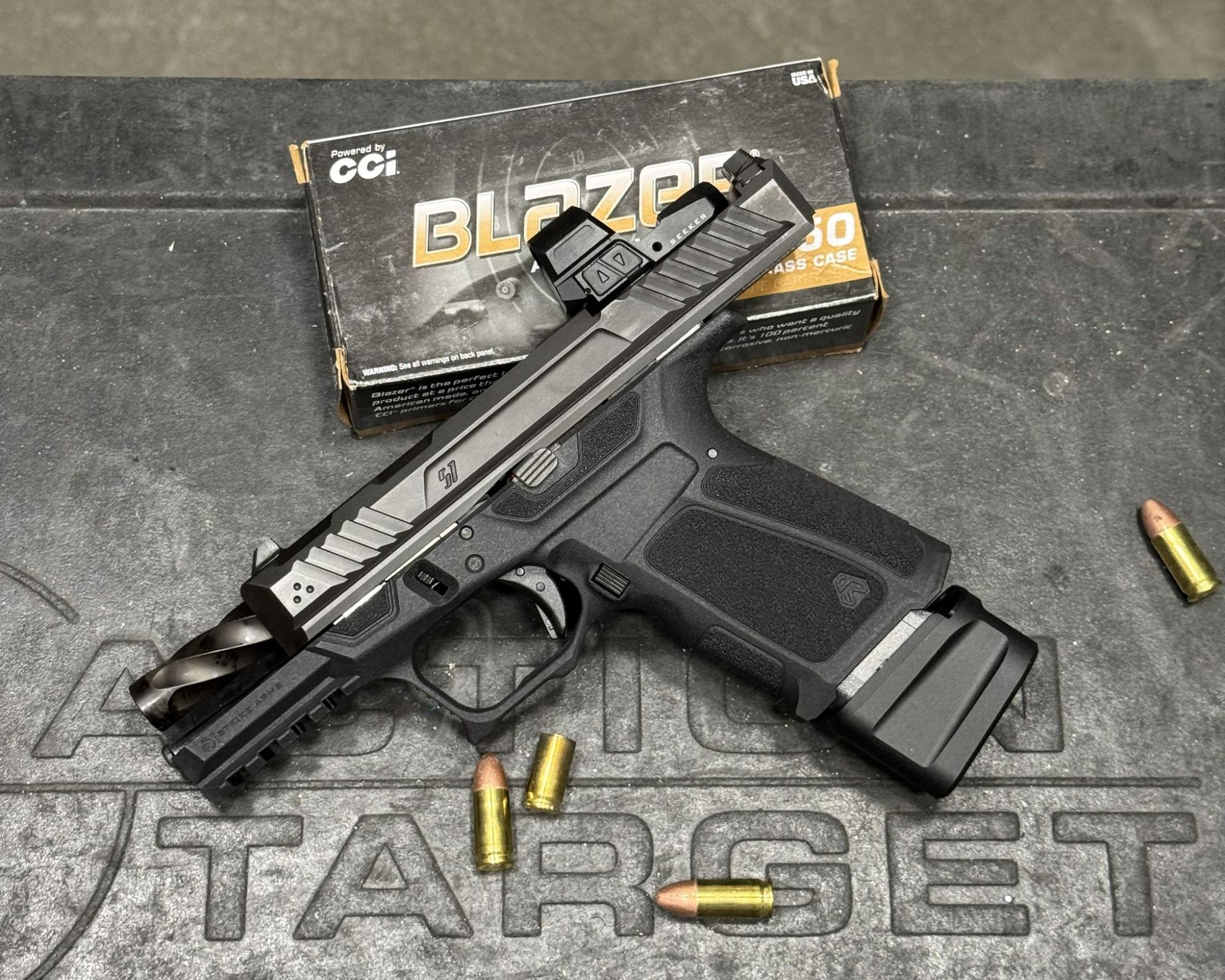 Profile view of the Strike Arms pistol highlighting the ergonomic curves, slide contouring, and optic-ready mount.