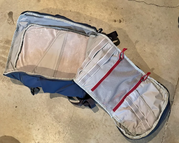 Interior of Vertx Gamut 26L backpack showing light-colored lining and gear organization slots