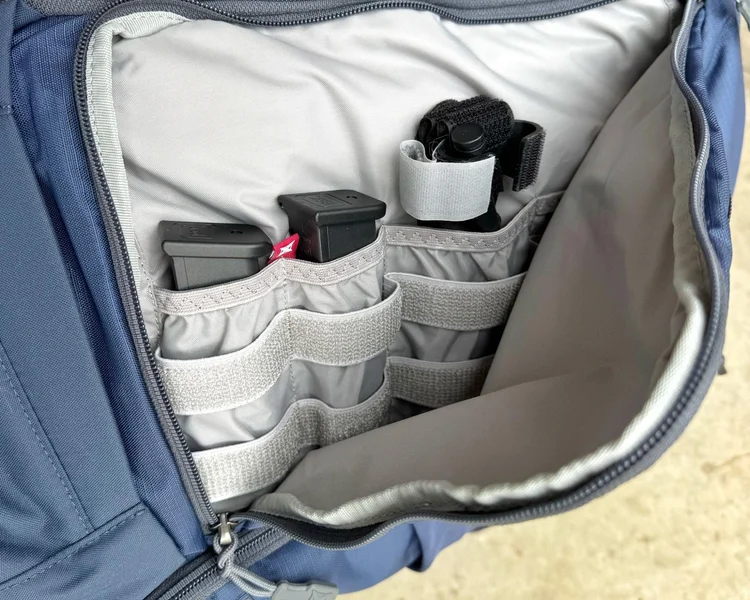 Internal mag pouches in Vertx Gamut 26L containing pistol magazines and a tourniquet