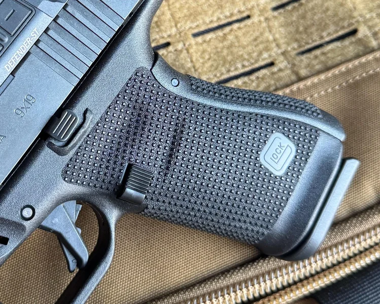 Detailed view of the aggressive RTF6 grip texture and the Glock logo on the Gen6 frame