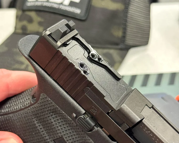Extreme close-up of the Glock 19 Gen6 slide showing the new direct-mount optics cut, moving away from the traditional MOS system