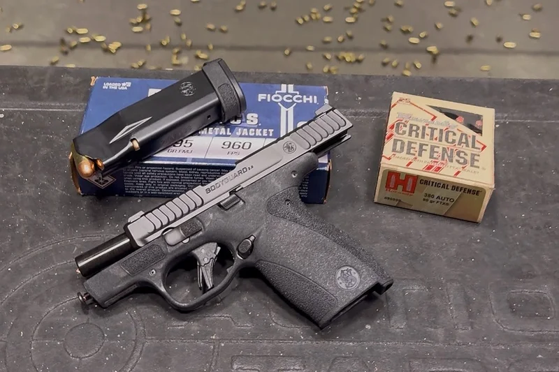 Smith & Wesson Bodyguard 2.0 pistol with slide locked back on a range table