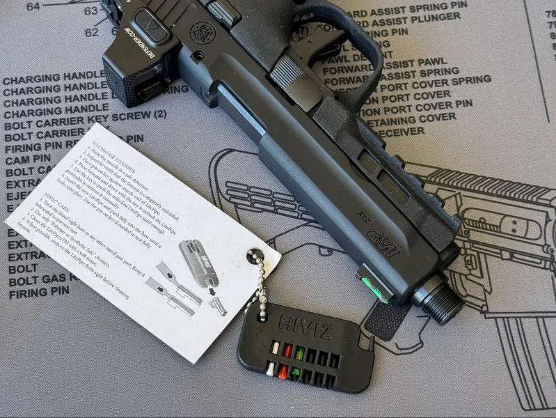 Smith & Wesson M&P22X accessories including threaded barrel adapter and HIVIZ fiber-optic pipes